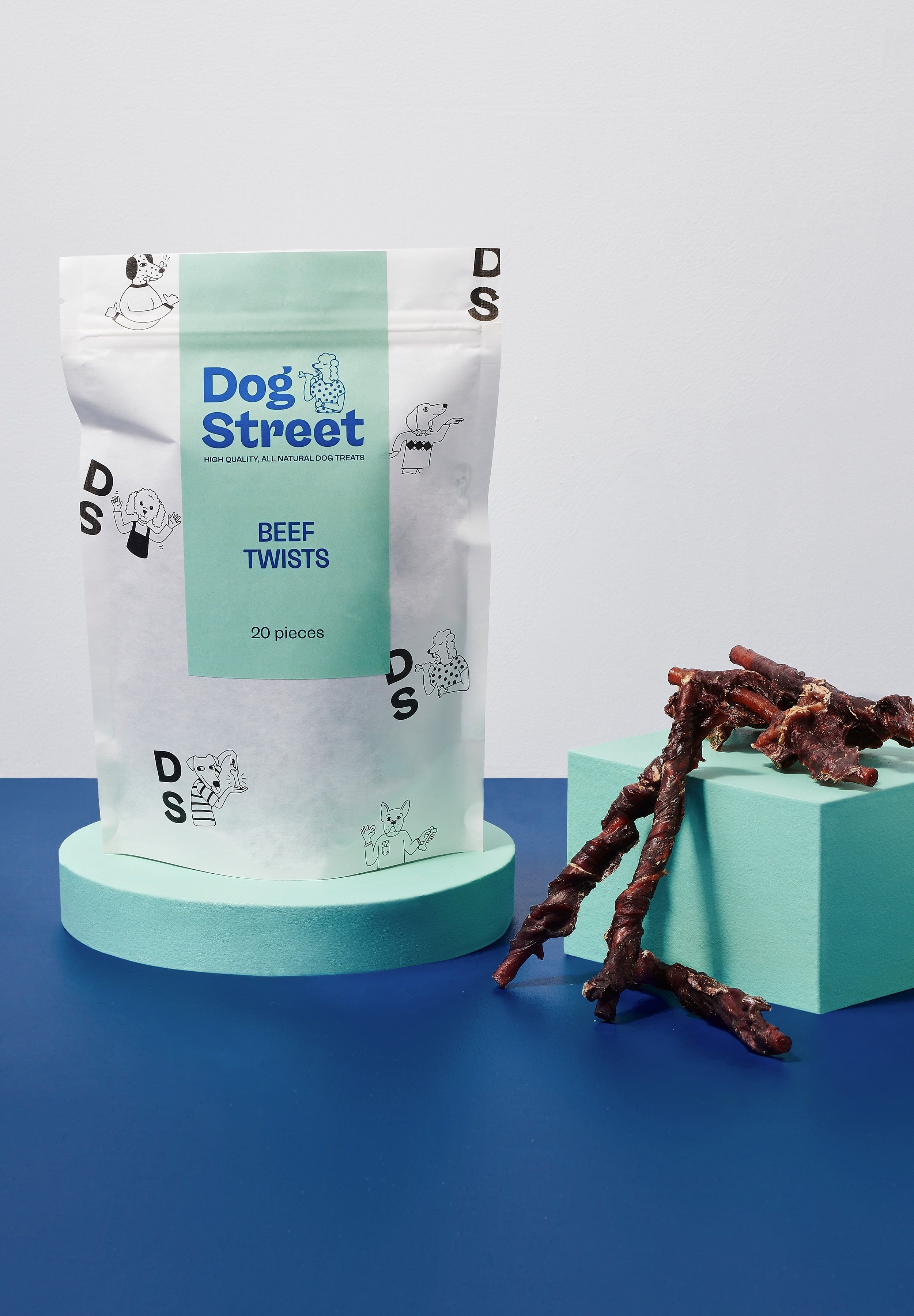 Styled shot of Dog Street Beef Twists pack and treats.