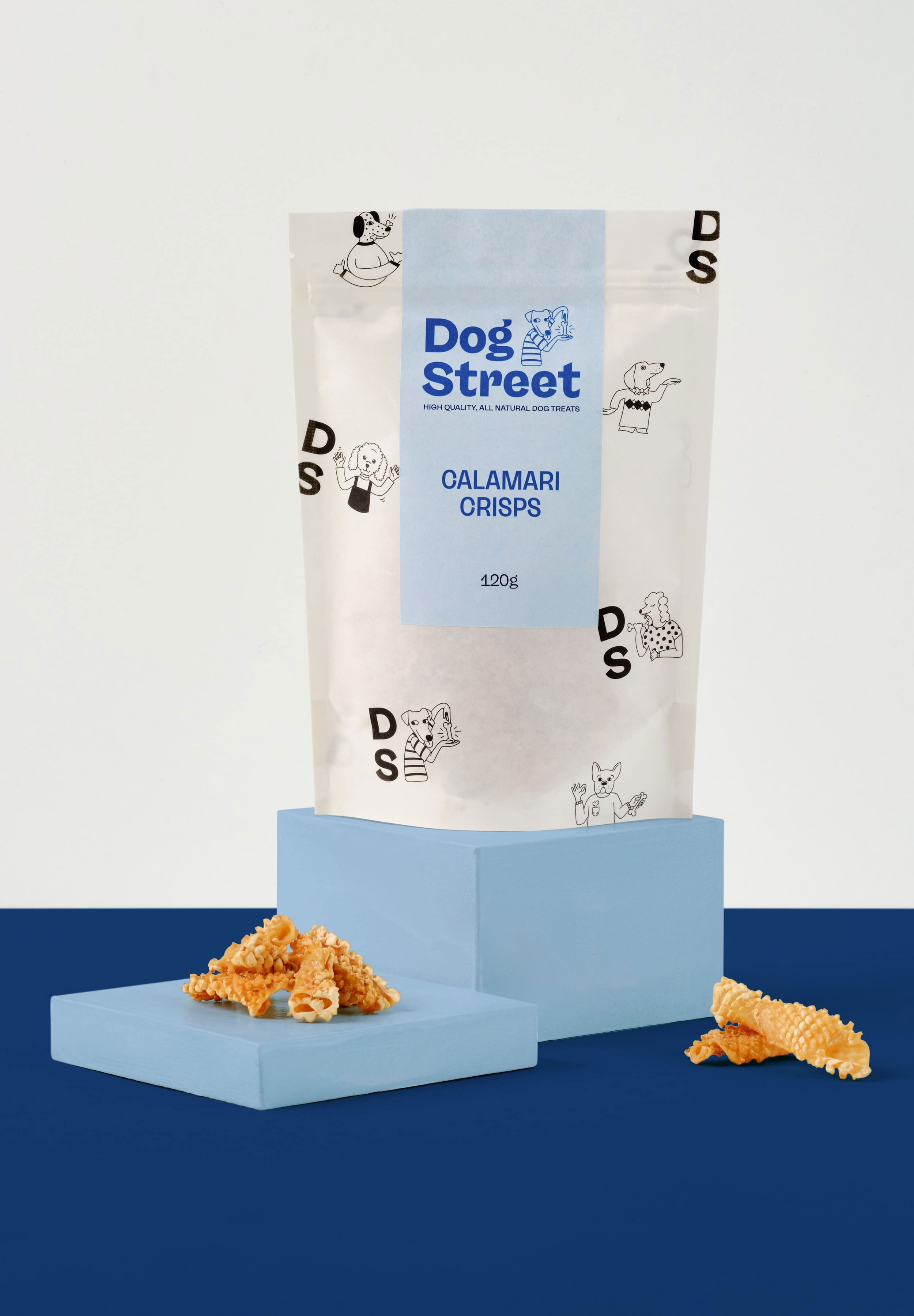 Styled shot of Dog Street Calamari Crisps pack and treats.