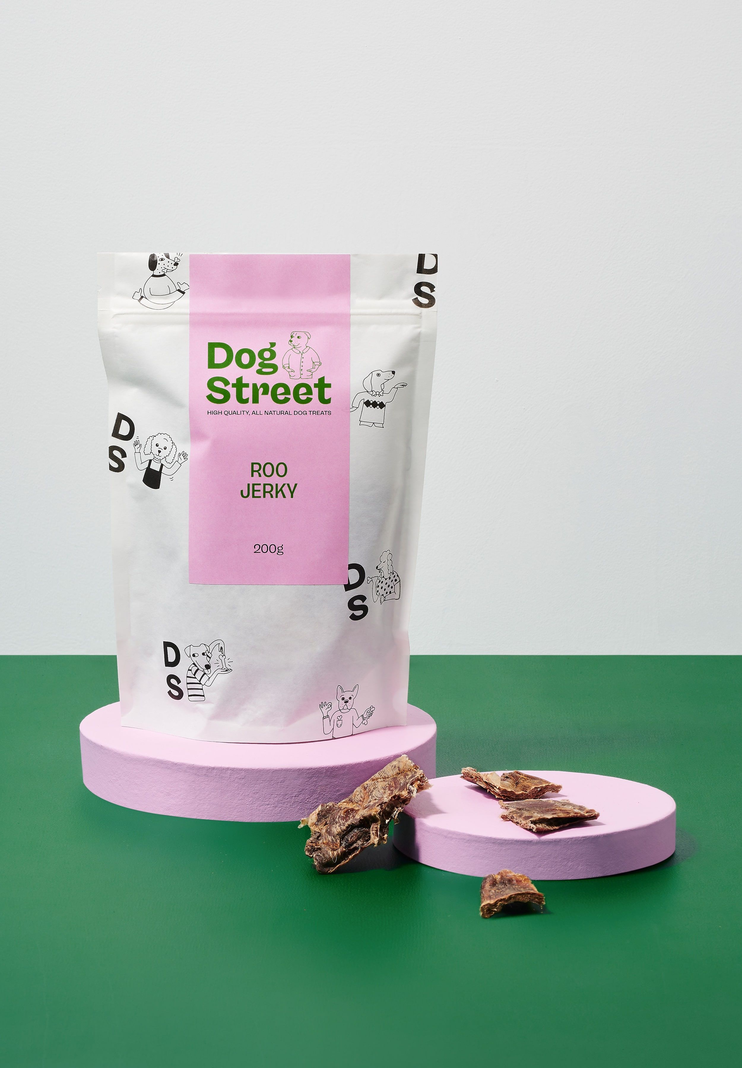 Styled shot of Dog Street Roo Jerky pack and treats.