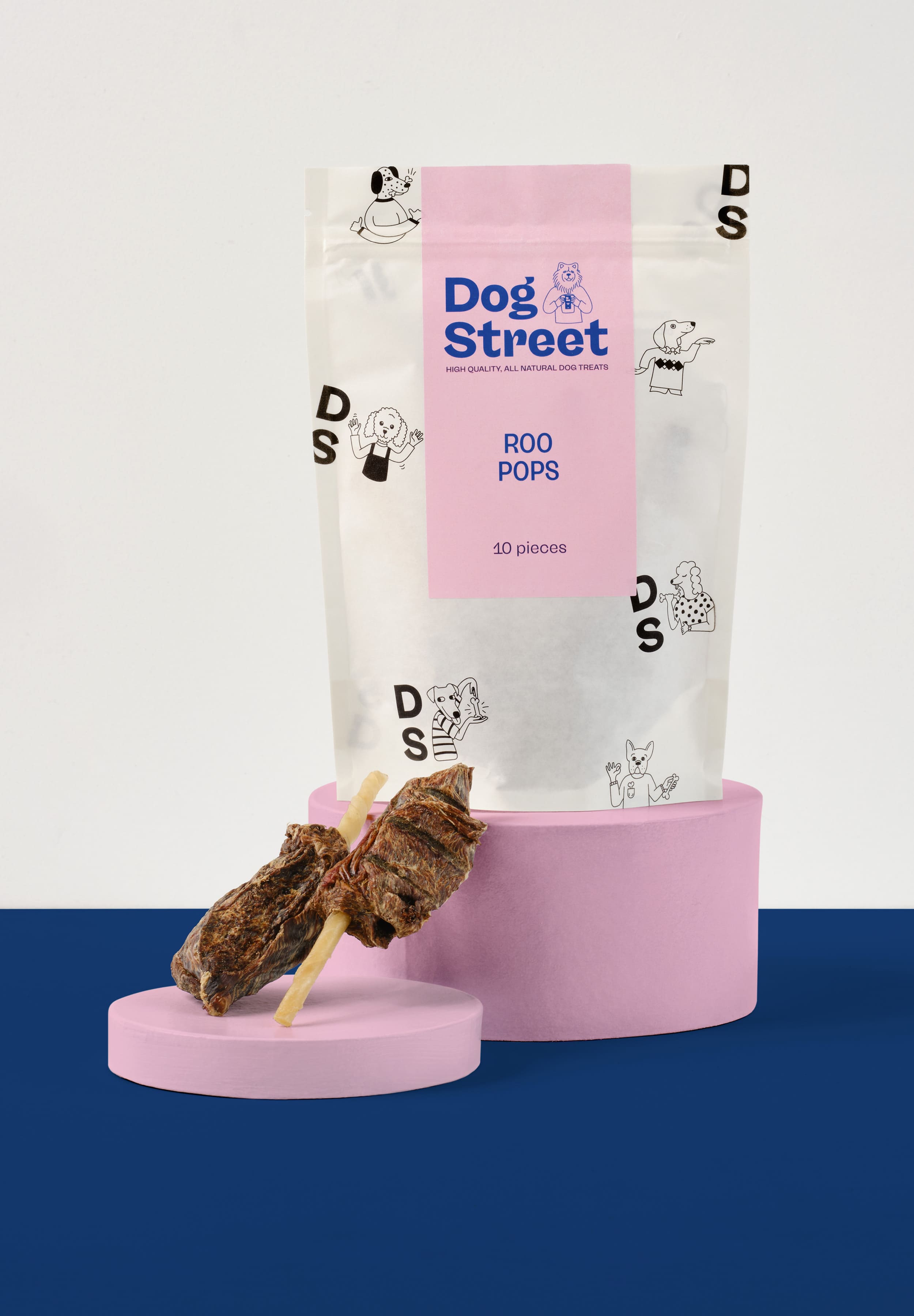 Styled shot of Dog Street Roo Pops pack and treats.