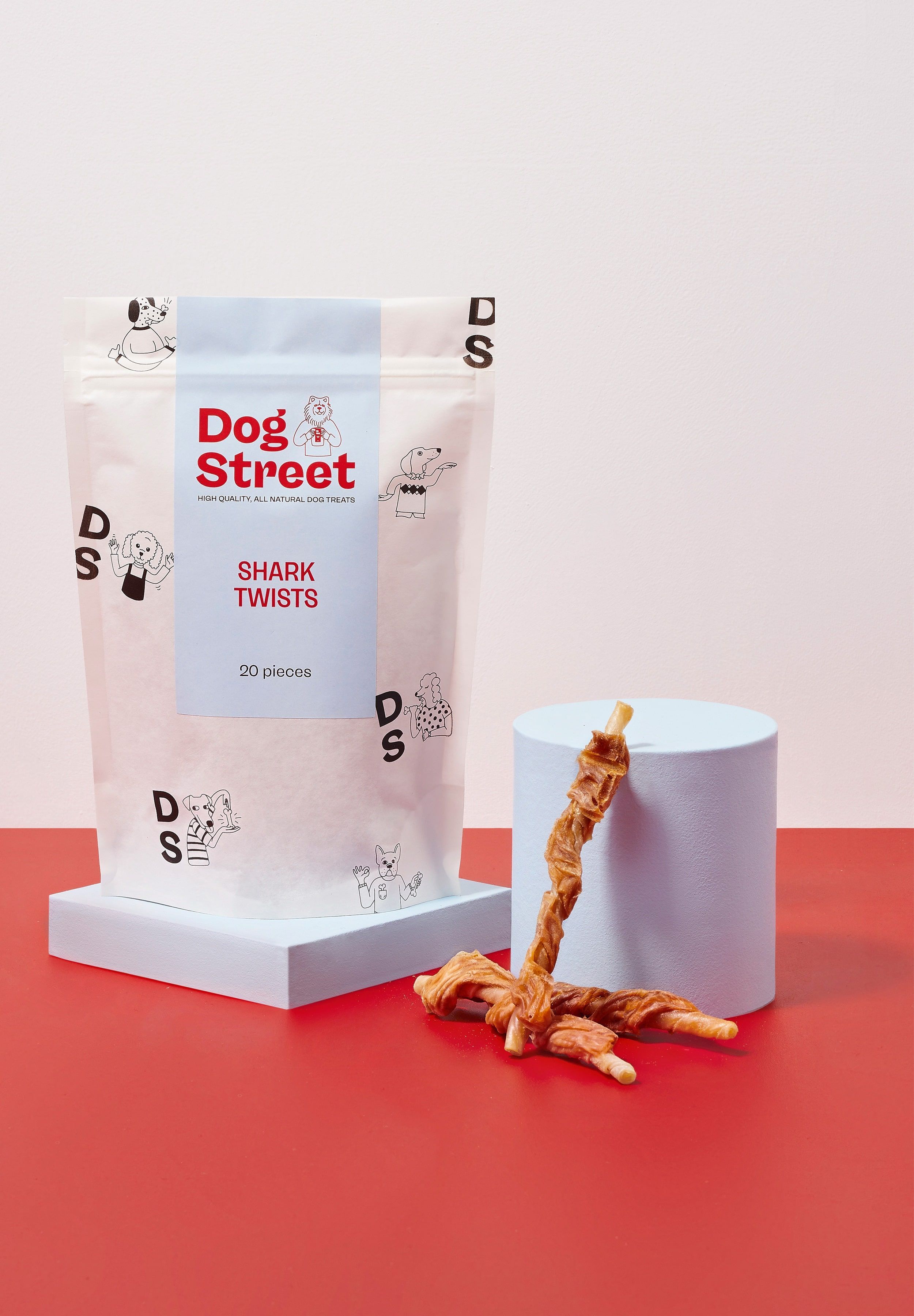 Styled shot of Dog Street Shark Twists pack and treats.